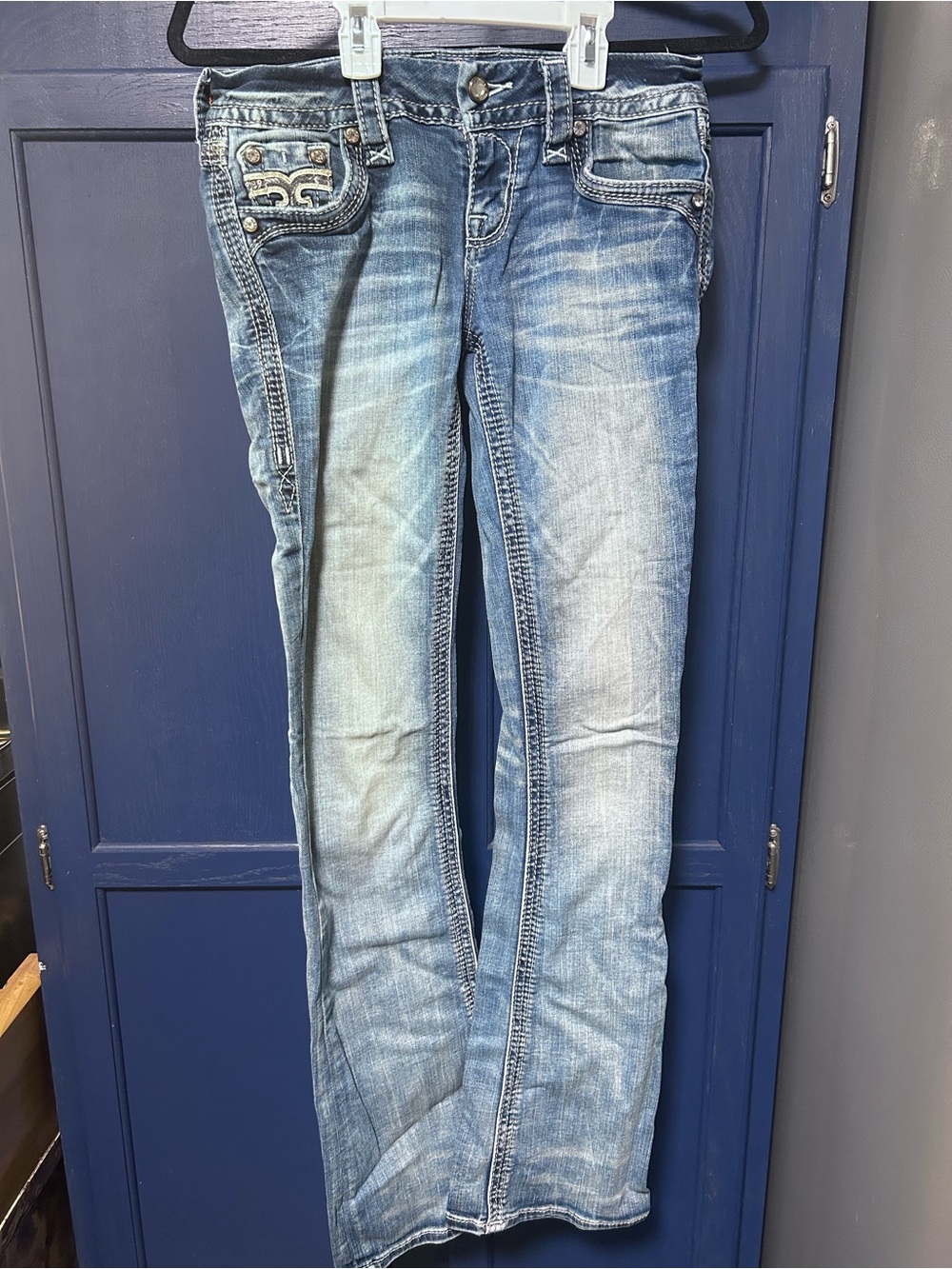 Rock Revival Blue Denim Jeans with Gold Accent Logo Patch